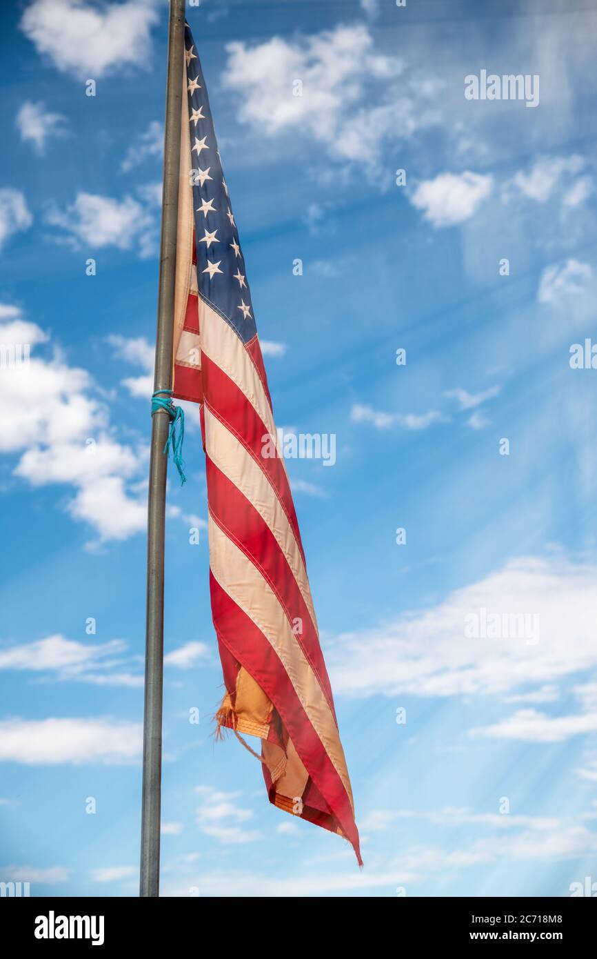 American flag against blue sky landscape, USA Stock Photo - Alamy