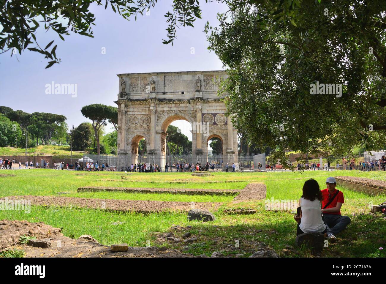 The north side of the imposing arch of Constantine, one of the three triumphal arches left in Rome, seen from the Colosseum park. Stock Photo