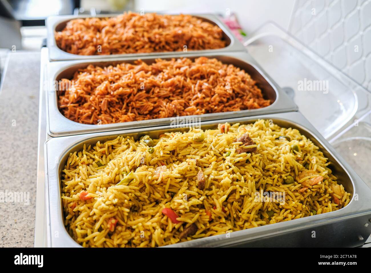 Nigerian Jollof and Vegetable Fried Rice served in Chaffing dish Stock