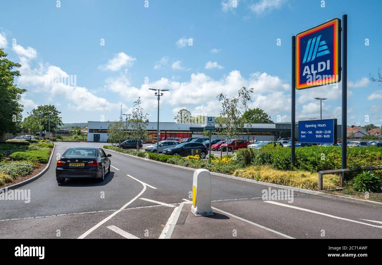 Aldi Supermarket. A car entering the supermarket retailer, Aldi, on a bright day in the East Sussex town of Eastbourne, England. Stock Photo
