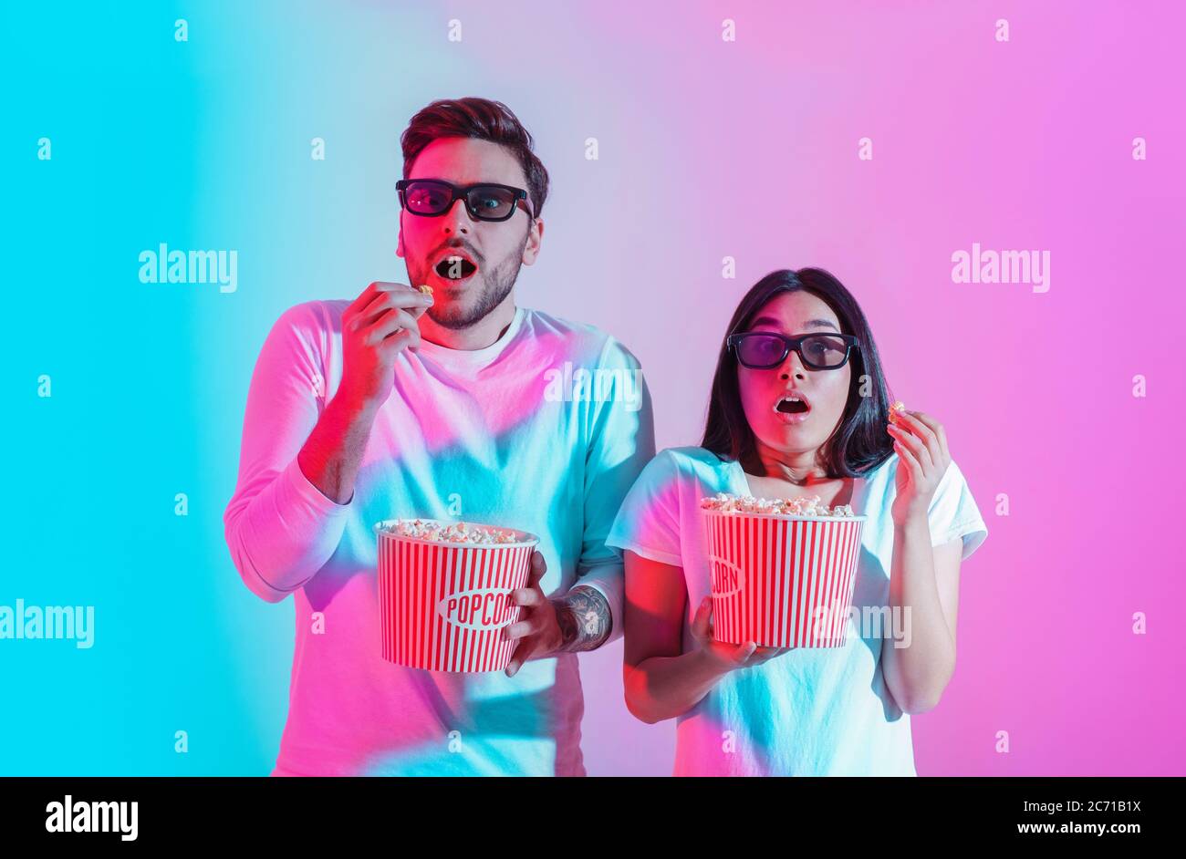 Special effects in movies. Surprised guy and girl with open mouths in