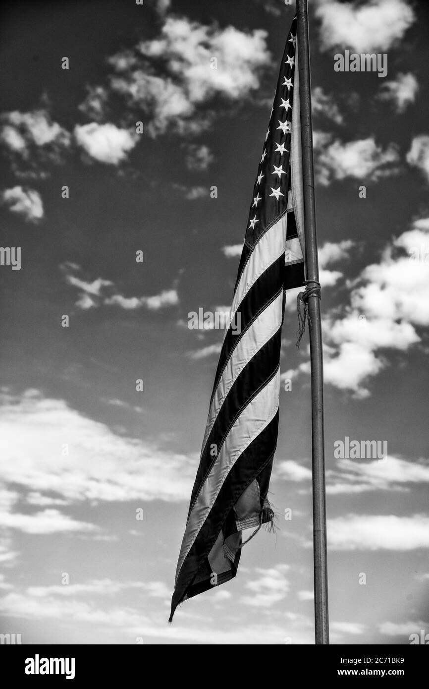 American flag against blue sky landscape, USA Stock Photo - Alamy