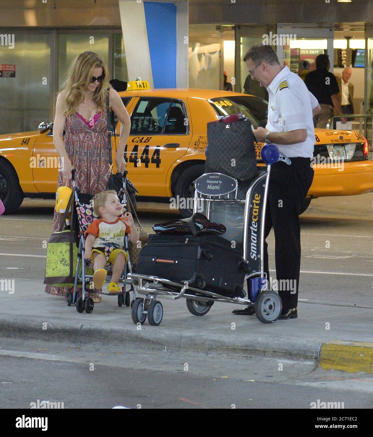 MIAMI, FL - JUNE 10: (EXCLUSIVE COVERAGE)  Actress Kelly Preston arrives with her son Benjamin Travolta at Miami International Airport on June 10, 2013 in Miami, Florida  People:  Kelly Preston Benjamin Travolta Stock Photo