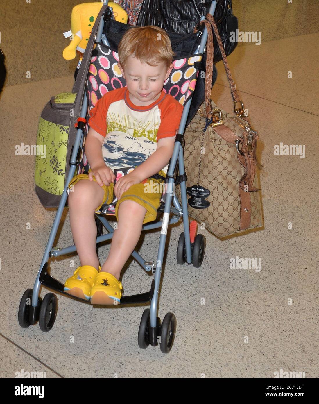 MIAMI, FL - JUNE 10: (EXCLUSIVE COVERAGE)  Actress Kelly Preston arrives with her son Benjamin Travolta at Miami International Airport on June 10, 2013 in Miami, Florida   People:  Benjamin Travolta Stock Photo