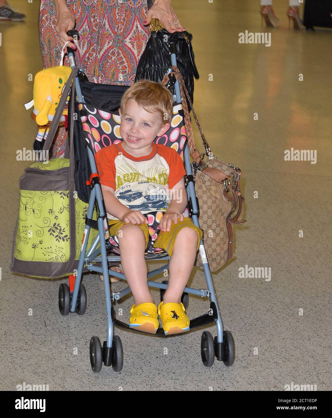 MIAMI, FL - JUNE 10: (EXCLUSIVE COVERAGE)  Actress Kelly Preston arrives with her son Benjamin Travolta at Miami International Airport on June 10, 2013 in Miami, Florida   People:  Benjamin Travolta Stock Photo