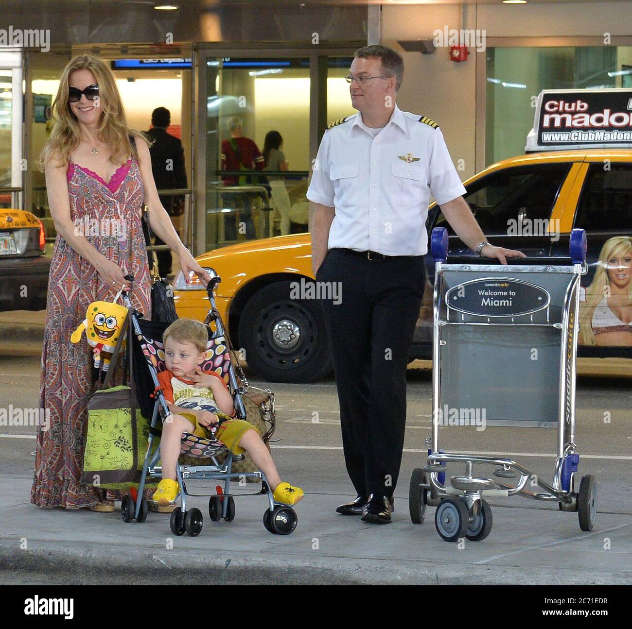 MIAMI, FL - JUNE 10: (EXCLUSIVE COVERAGE)  Actress Kelly Preston arrives with her son Benjamin Travolta at Miami International Airport on June 10, 2013 in Miami, Florida  People:  Kelly Preston_Benjamin Travolta Stock Photo