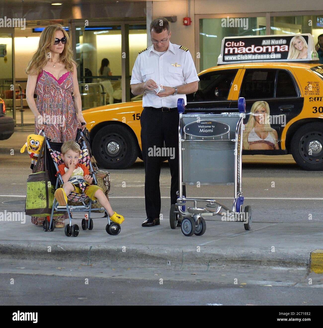 MIAMI, FL - JUNE 10: (EXCLUSIVE COVERAGE)  Actress Kelly Preston arrives with her son Benjamin Travolta at Miami International Airport on June 10, 2013 in Miami, Florida  People:  Kelly Preston Benjamin Travolta Stock Photo