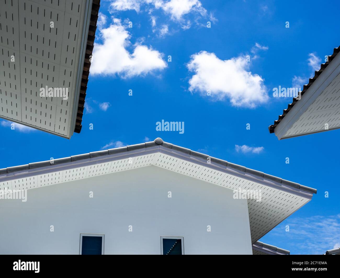 Simple white house on blue sky and clouds background on sunny day Stock ...