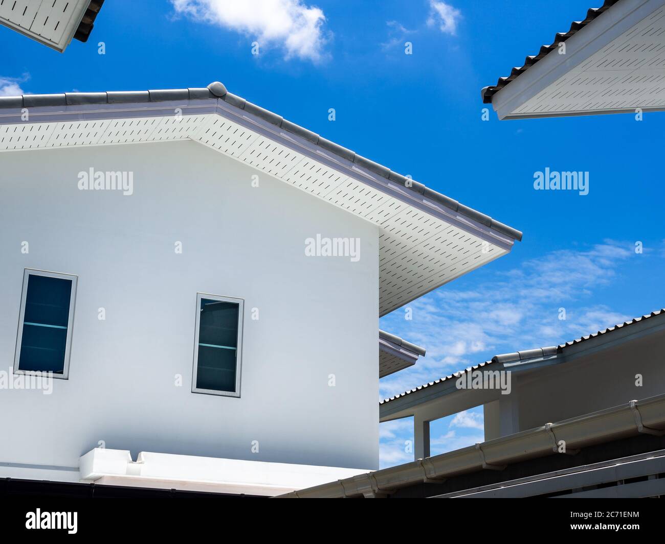 Simple white house on blue sky and clouds background on sunny day Stock ...