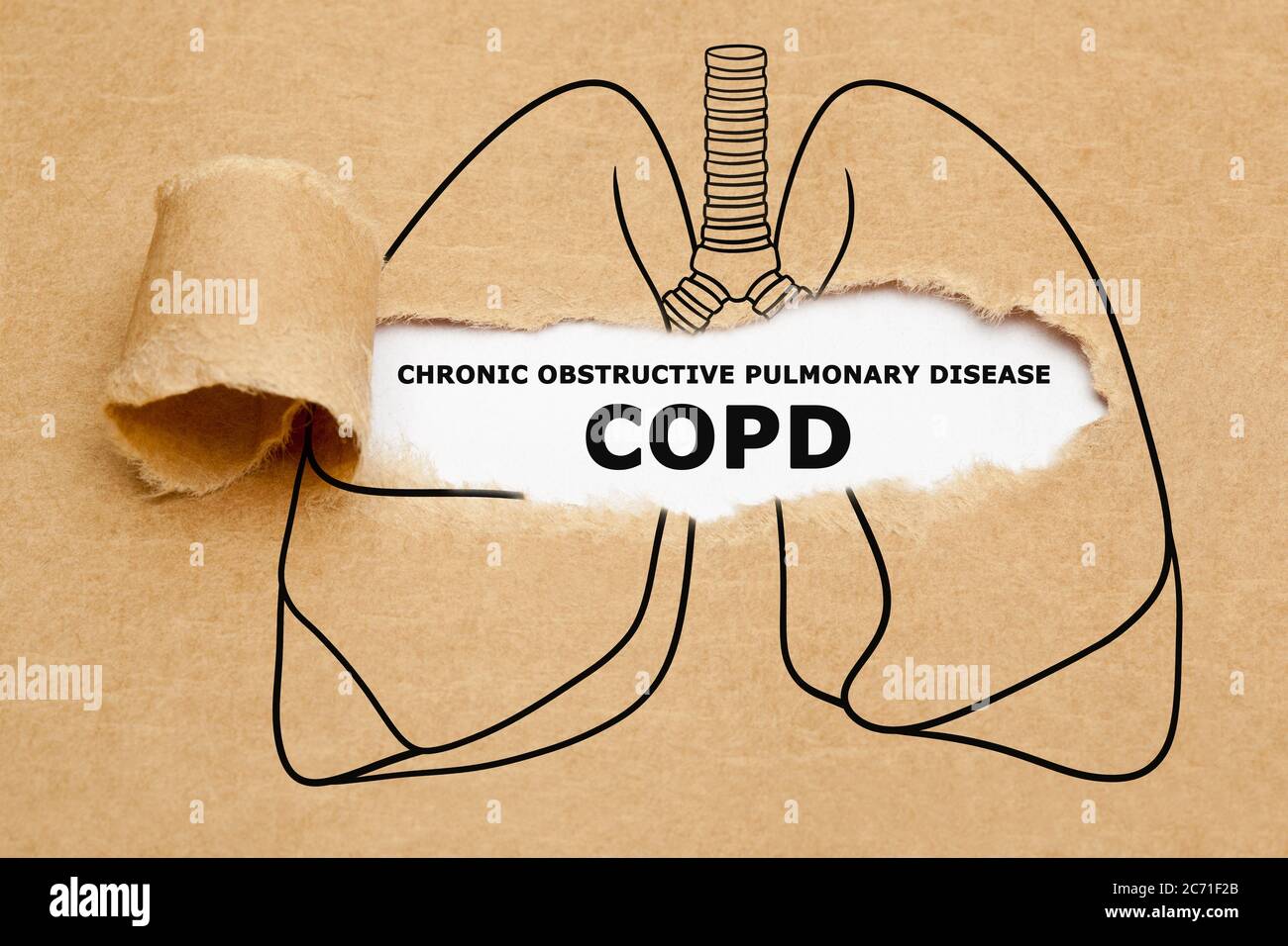 Text Chronic Obstructive Pulmonary Disease COPD appearing behind torn brown paper in human lungs drawing. Stock Photo