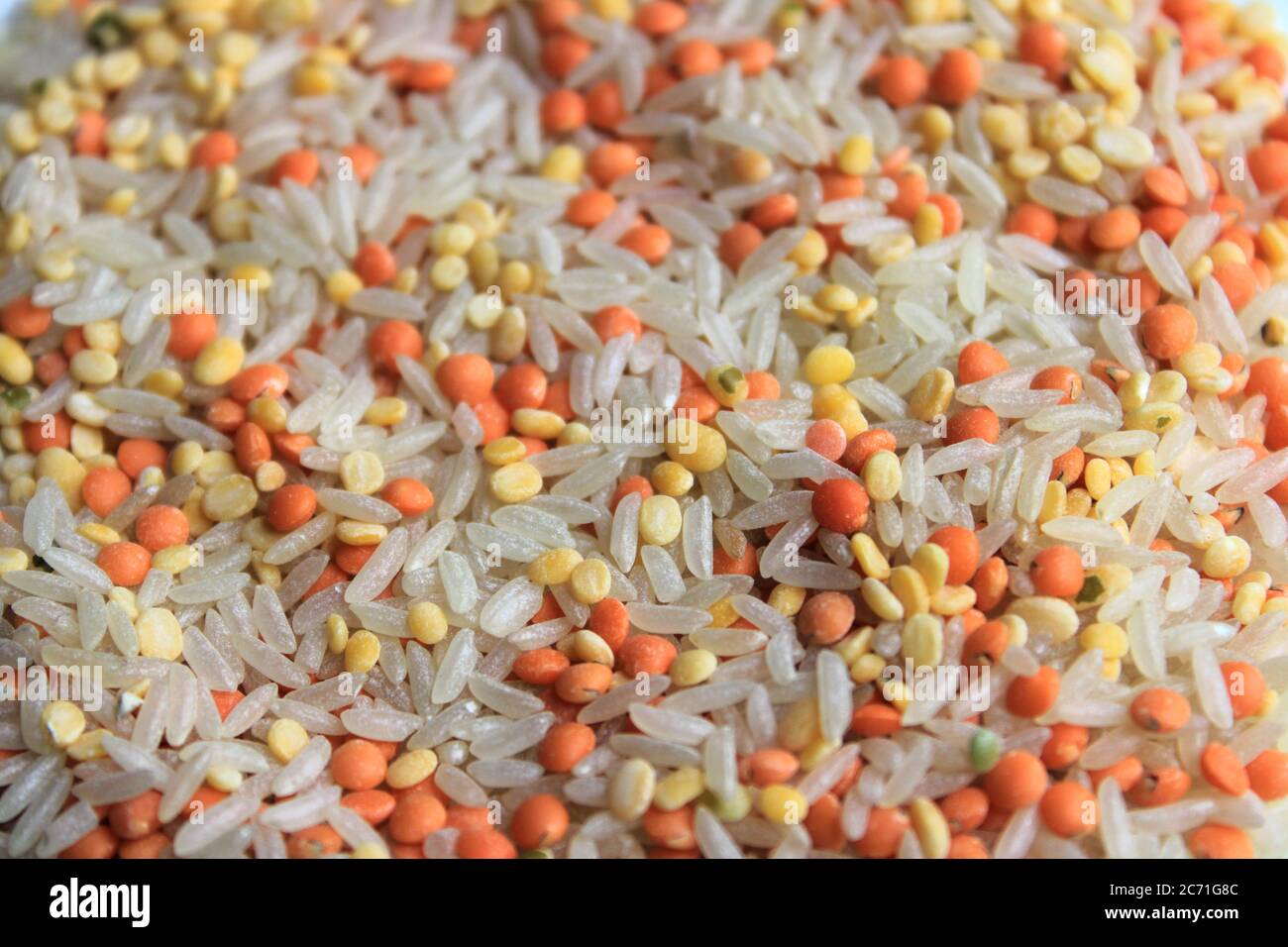 Pile of uncooked rice grain, red lentils and pigeon pea. Rice grains