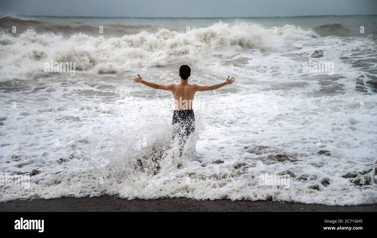 Antalya Turkey October 17, 2013 Young man standing against the sea