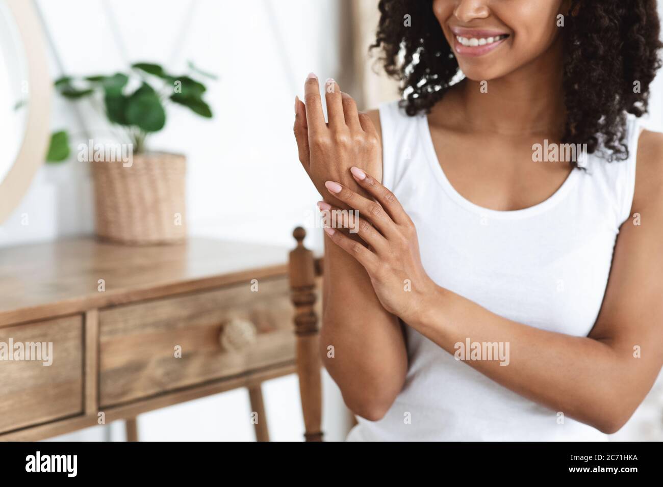 Anti-Aging Hand Care. Smiling African Woman Touching Her Soft Body Skin Stock Photo