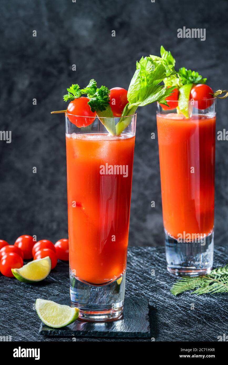 Bloody Mary cocktail with vodka and tomato juice with garnishes