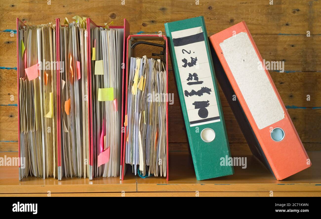 messy file folders and documents, bureaucracy and red tape concept ...