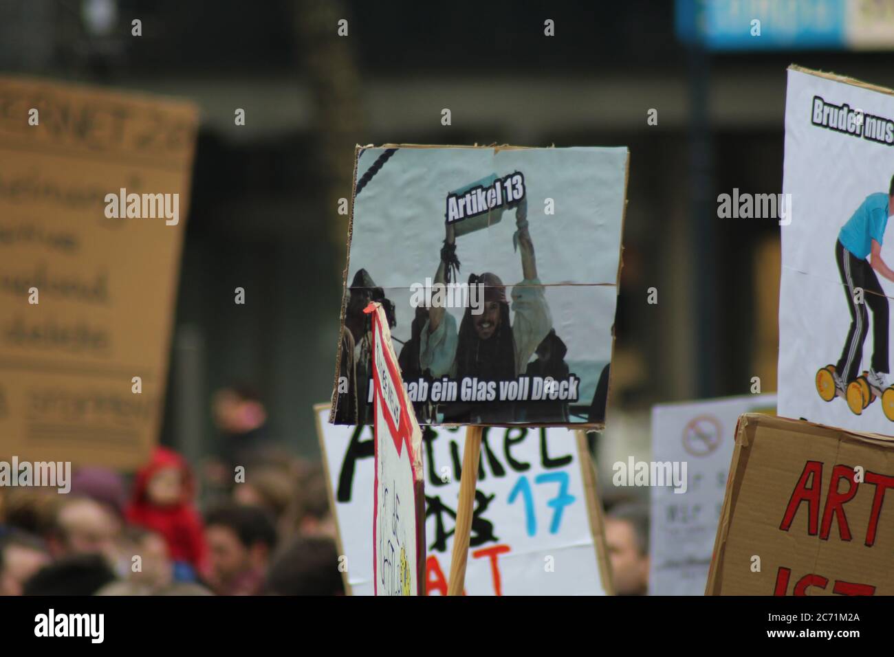 Demonstrators in Dortmund, NRW, Germany, hold up a protest sign quoting "Pirates of the Caribbean", calling an proposed law "jar of dirt" Stock Photo