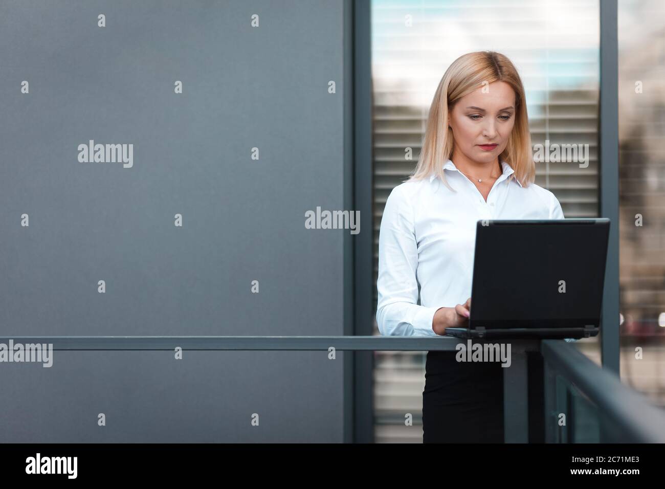 Business lady working on a laptop Stock Photo