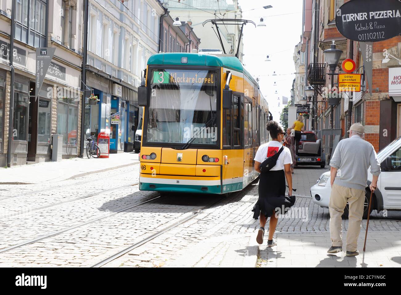 Norrkoping, Sweden - July 3, 2020: Yellow tram in service on line 3 at the Drottninggatan street. Stock Photo