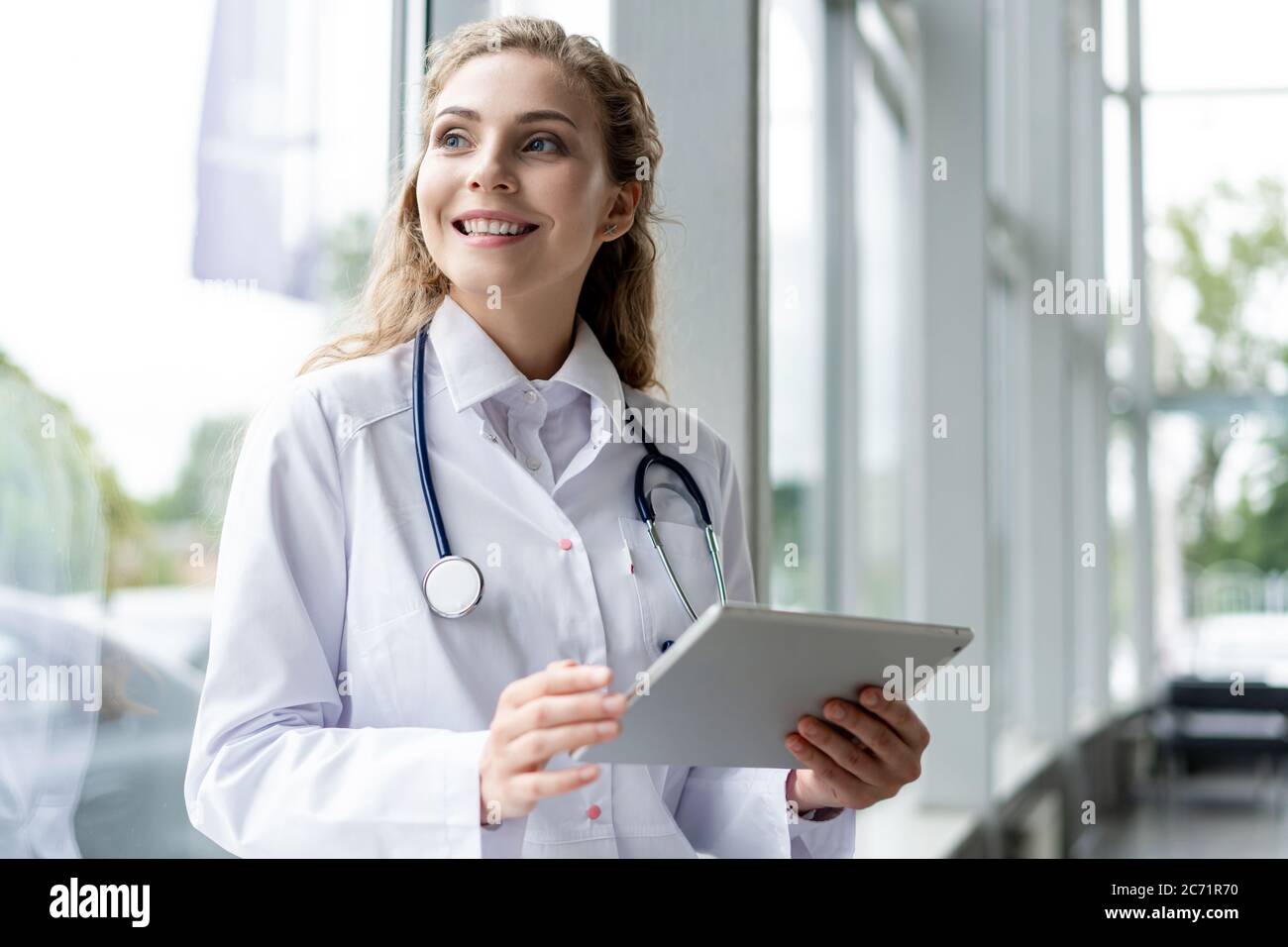 healthcare, technology and medicine concept - smiling female doctor ...