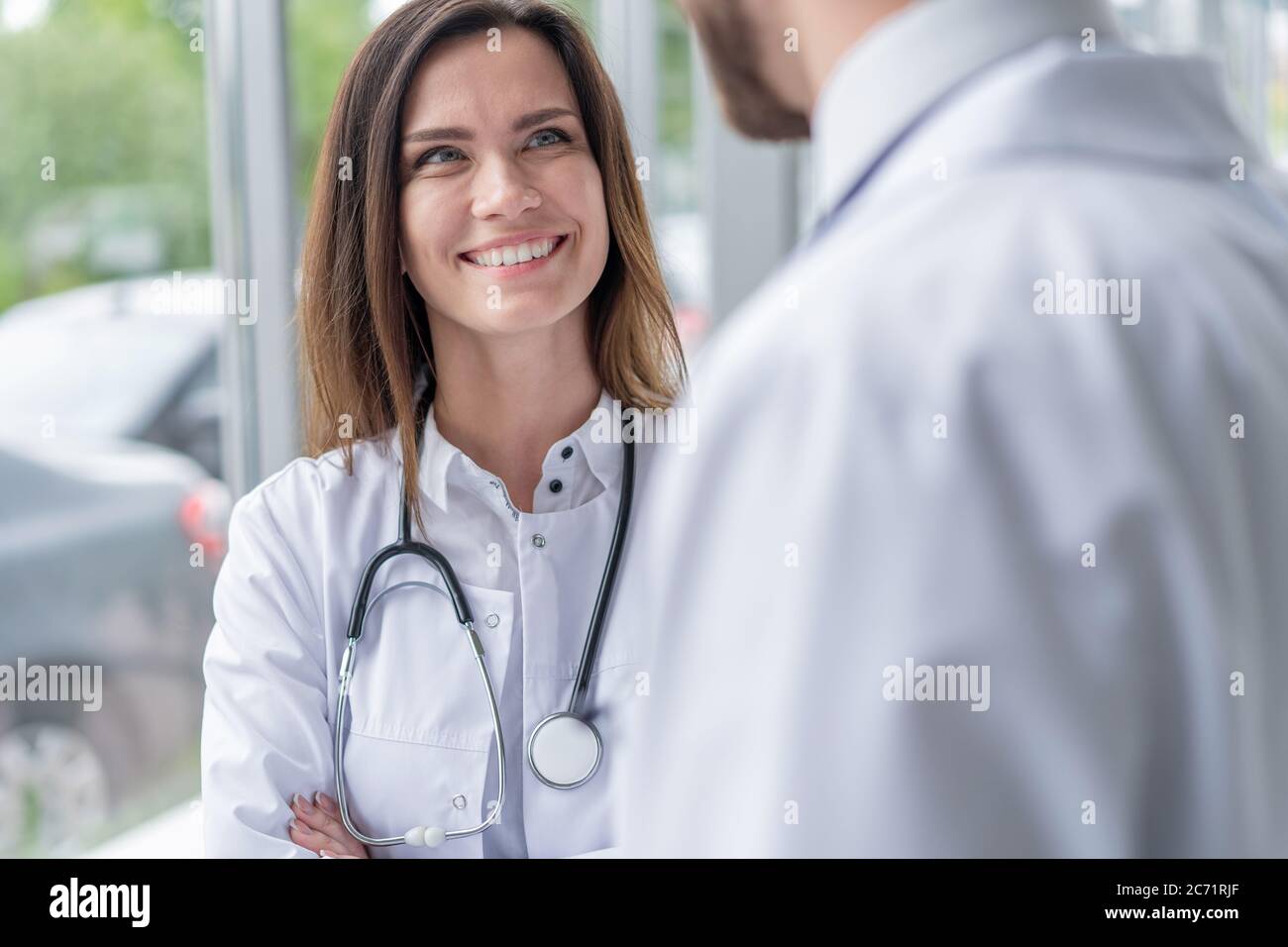 Medical Staff Having Discussion In Modern Hospital Corridor Stock Photo ...