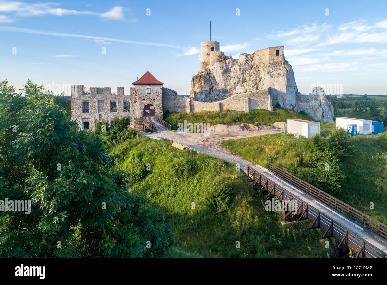 Rabsztyn, Poland. Ruins of medieval royal castle on the rock in Polish Jurassic Highland. Aerial view in sunrise light in summer Stock Photo