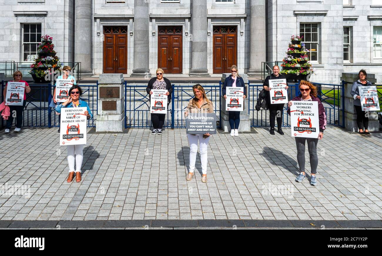 Cork, Ireland. 13th July, 2020. Former Debenhams workers are protesting outside Cork Council House this evening. The protesters are demanding Debenhams pay them a redundancy package after they were sacked due to Debenhams closing its Cork City store. The protest coincides with the last council meeting before the summer break. Credit: AG News/Alamy Live News Stock Photo
