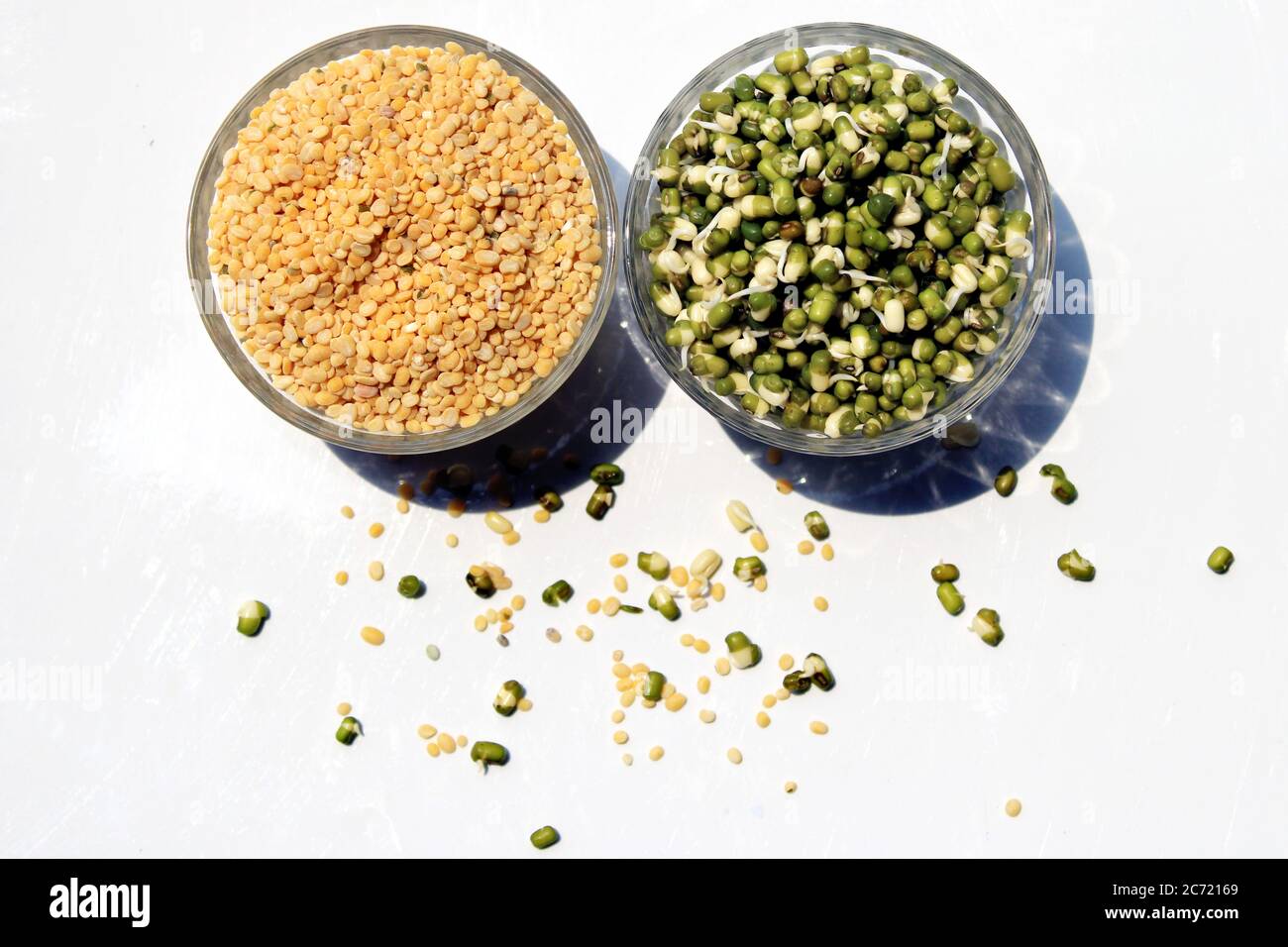 Fresh, healthy sprouted mung dal or moong beans. Toor dal ( skinned and split pigeon pea ) in a bowl. Yellow moong dal, skinned and split mung bean. Stock Photo