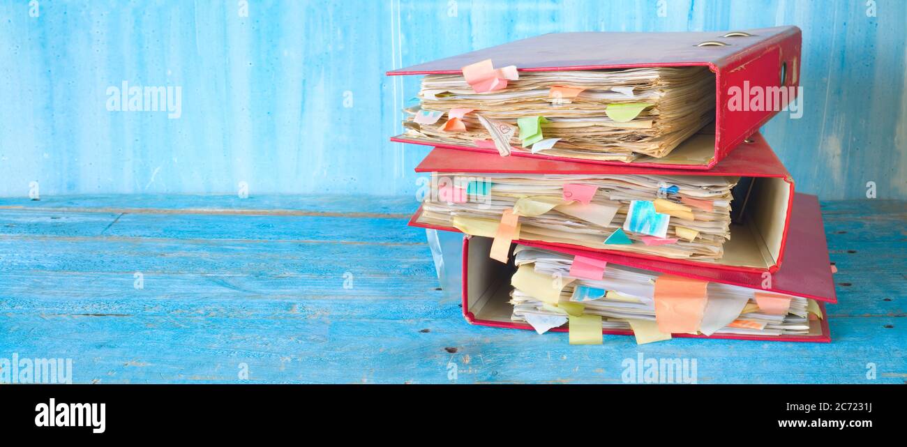messy file folders and documents,  bureaucracy and red tape concept. good copy space Stock Photo