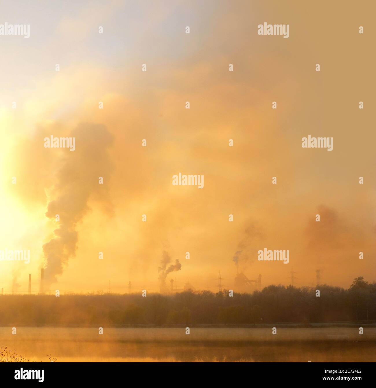 Gas, steam and smoke. Industrial chimneys time lapse. Metallurgical industrial factory. Poisoned air. Epic pollution of nature. Toxic substances. Stock Photo