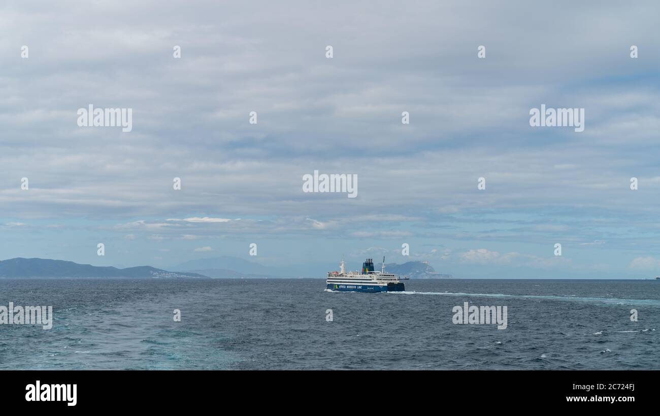 Tangier, Morocco - April 2018: Ferry sailing in Strait of Gibraltar back and forth from Tarifa Spain to Tangier in Morocco. Stock Photo