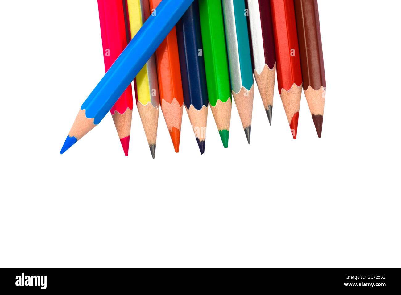 Blue colored pencil crayons placed on top of a row of pencils on a