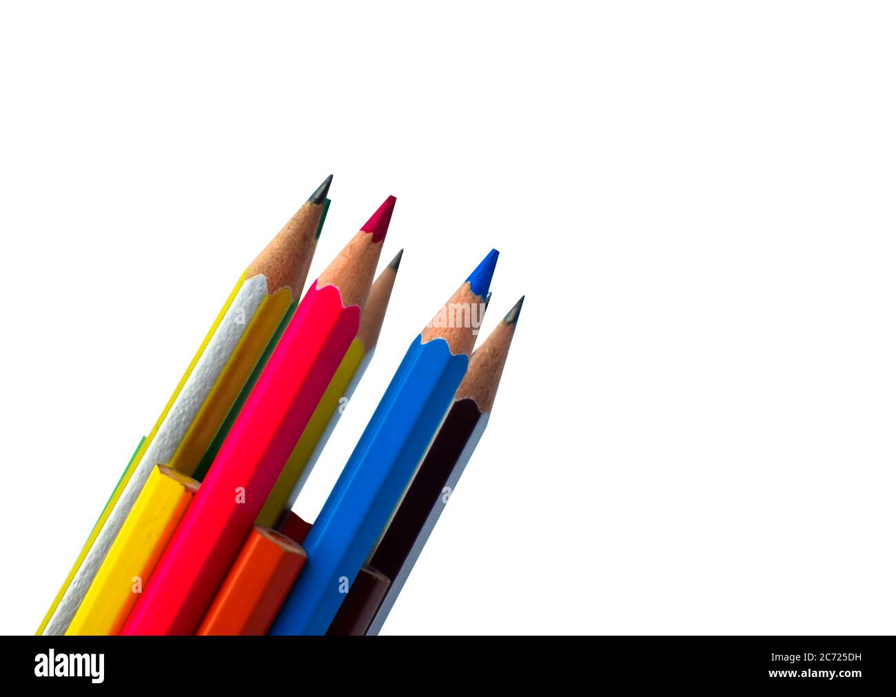 Pile of different colored wood pencil crayon placed on a white paper