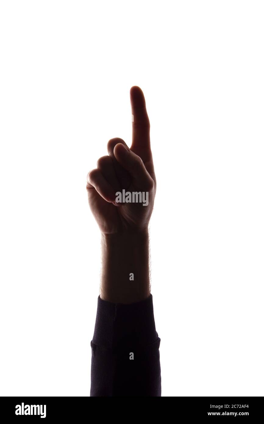 The hand of a young man with his fingers apart, number the one - silhouette, concept abstraction Stock Photo