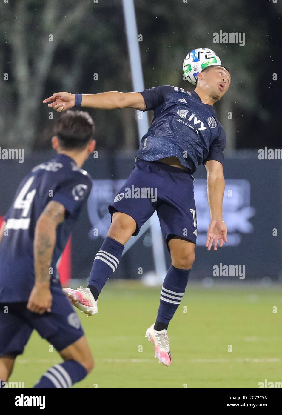 July 12, 2020: Sporting Kansas City midfielder ROGER ESPINOZA (15) gets a header during the MLS is Back Tournament Sporting Kansas City vs Minnesota match at ESPN Wide World of Sports Complex in Orlando, Fl on July 12, 2020. Credit: Cory Knowlton/ZUMA Wire/Alamy Live News Stock Photo
