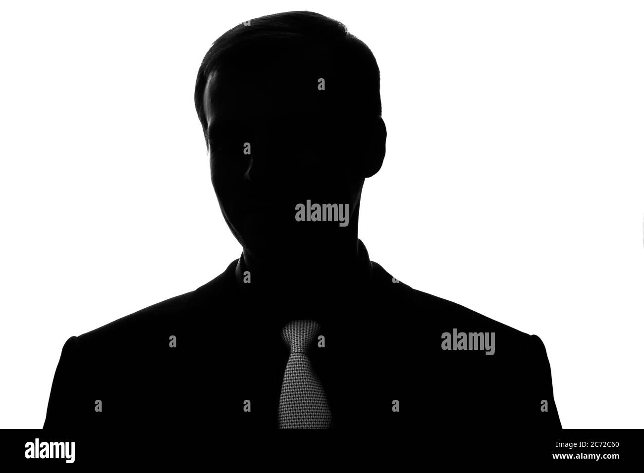 Portrait young man in suit, tie in front view - silhouette Stock Photo