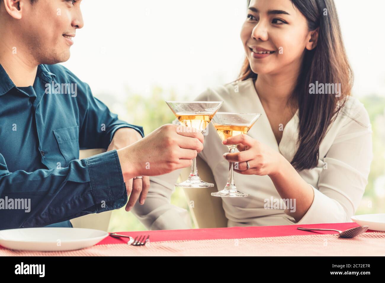 Happy romantic couple eating lunch at restaurant Stock Photo