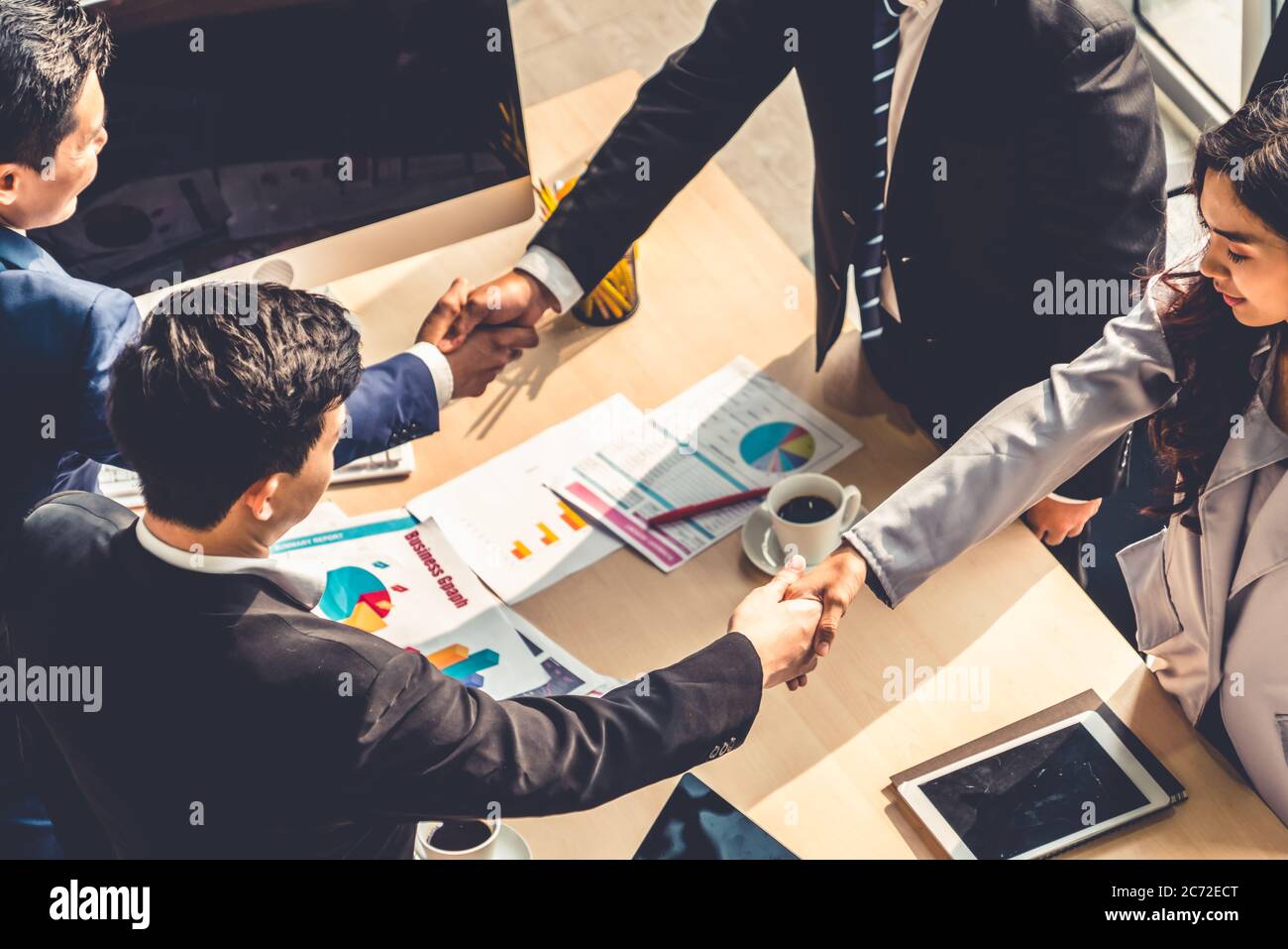 Aerial meeting table handshake hi-res stock photography and images - Alamy