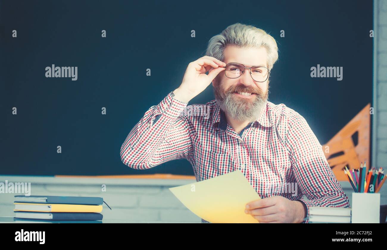 The handsome mad bearded scientist with question. Stock Photo