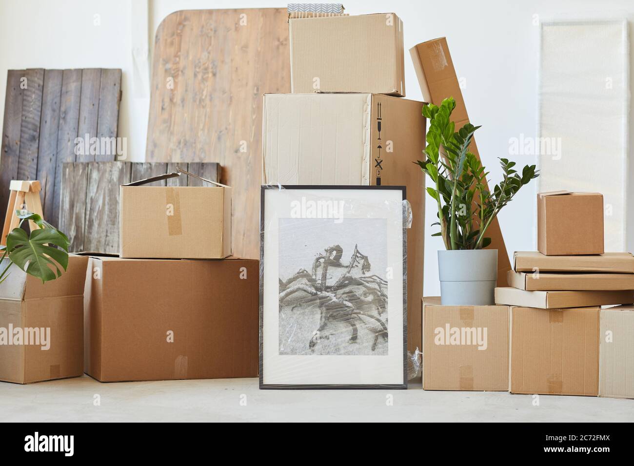 Image of picture and other things packed in boxes prepared for relocation Stock Photo