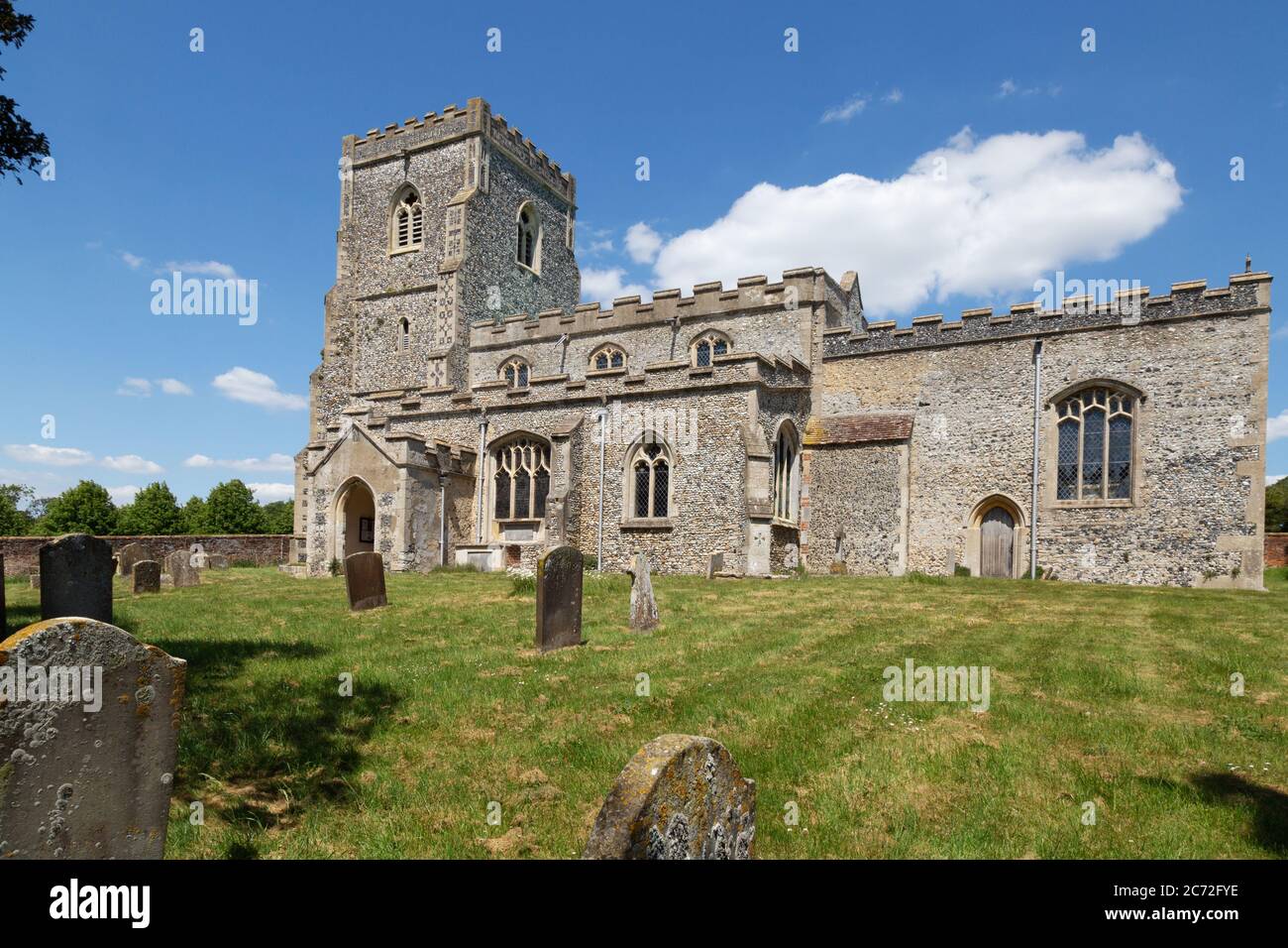 English village church; Exterior of the 17th century Church of St Mary the Virgin and churchyard; Dalham village, Suffolk UK Stock Photo