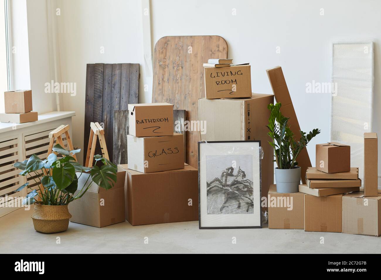 Image of packed signed boxes and other things prepared for relocation Stock Photo