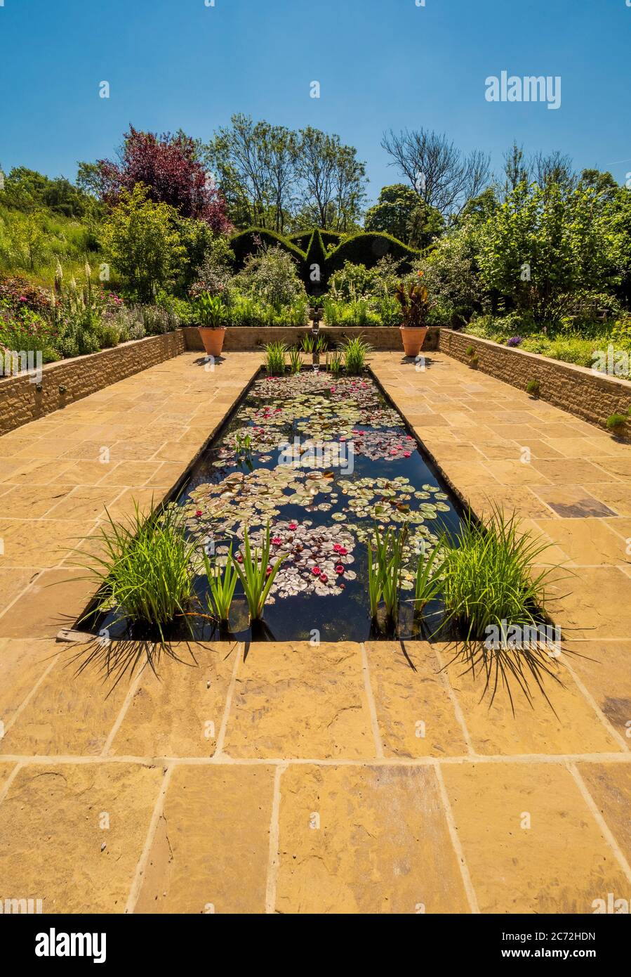 The rectangular pool of the Edwardian garden at RHS Harlow Carr, Harrogate, North Yorkshire, UK Stock Photo