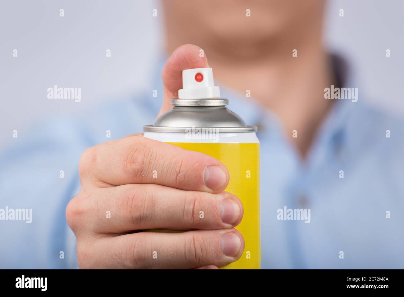 Download Hand Holds Yellow Spray Bottle Close Up Front View Stock Photo Alamy Yellowimages Mockups