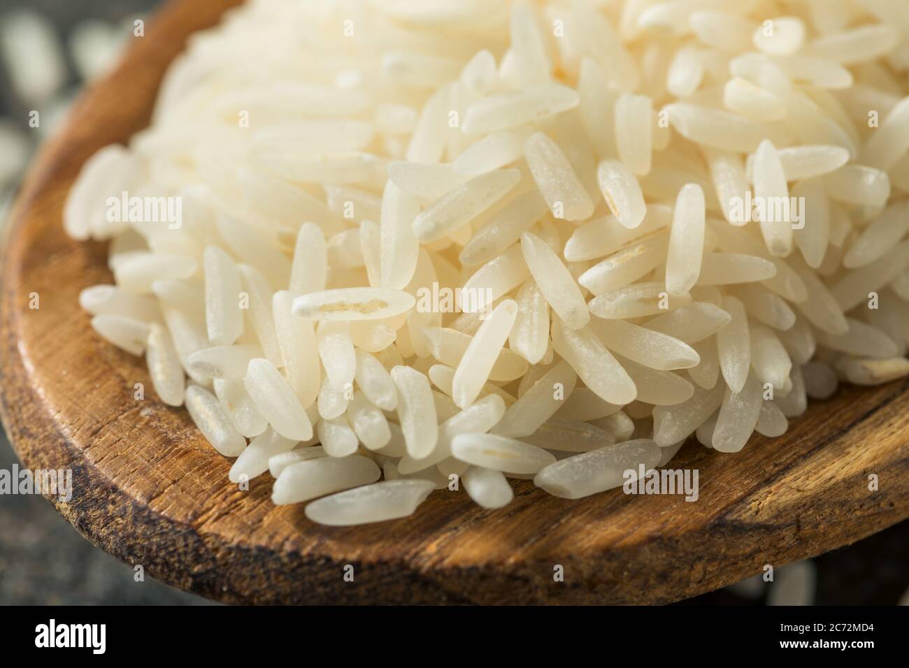 Dry White Long Grain Jasmine Rice in a Spoon Stock Photo Alamy