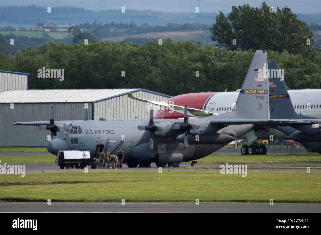 Prestwick, Scotland, UK. 13th July, 2020. Pictured: A US Air Force C130 Hercules Aircraft (Reg 56709) sit on the tarmac by the Ryanair Hanger as airforce personal deplane while the aircraft gets fuelled. Credit: Colin Fisher/Alamy Live News Stock Photo