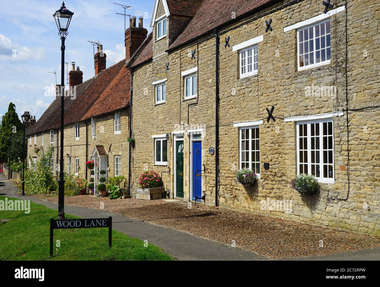 A terrace of attractive stone cottages at Weston Underwood Stock Photo