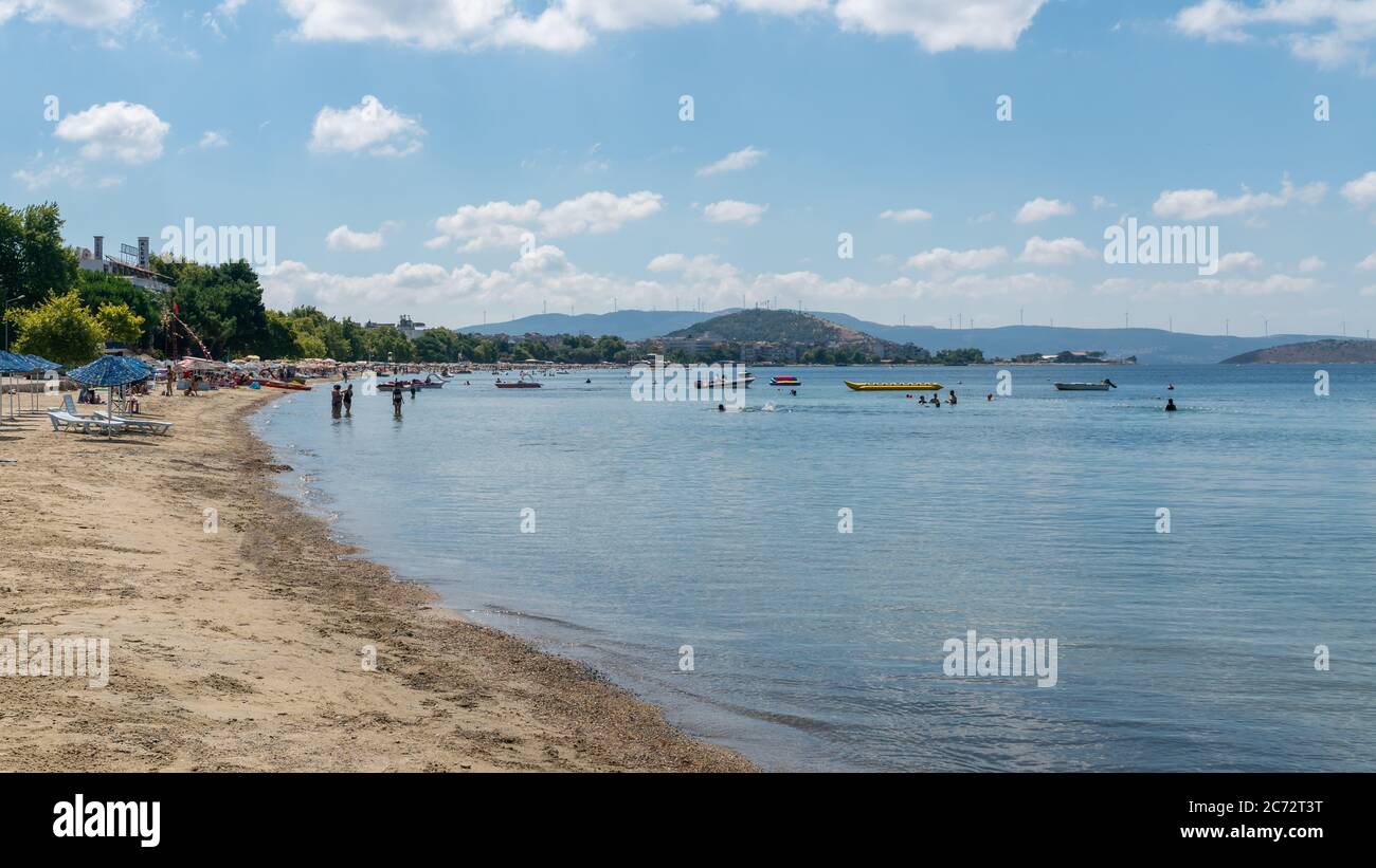 Balikesir, Erdek, Turkey - July 2019: Beach of Erdek with people under the sun and swimming in the Marmara sea. Stock Photo