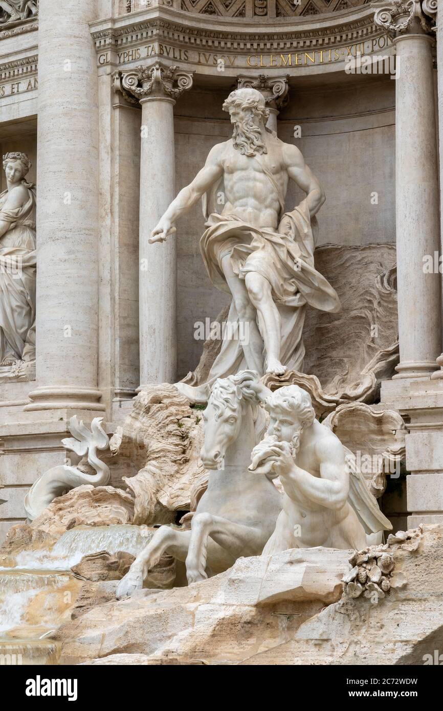 Closeup side view of the statues of the Trevi Fountain in Rome. Italy. Vertically. Stock Photo