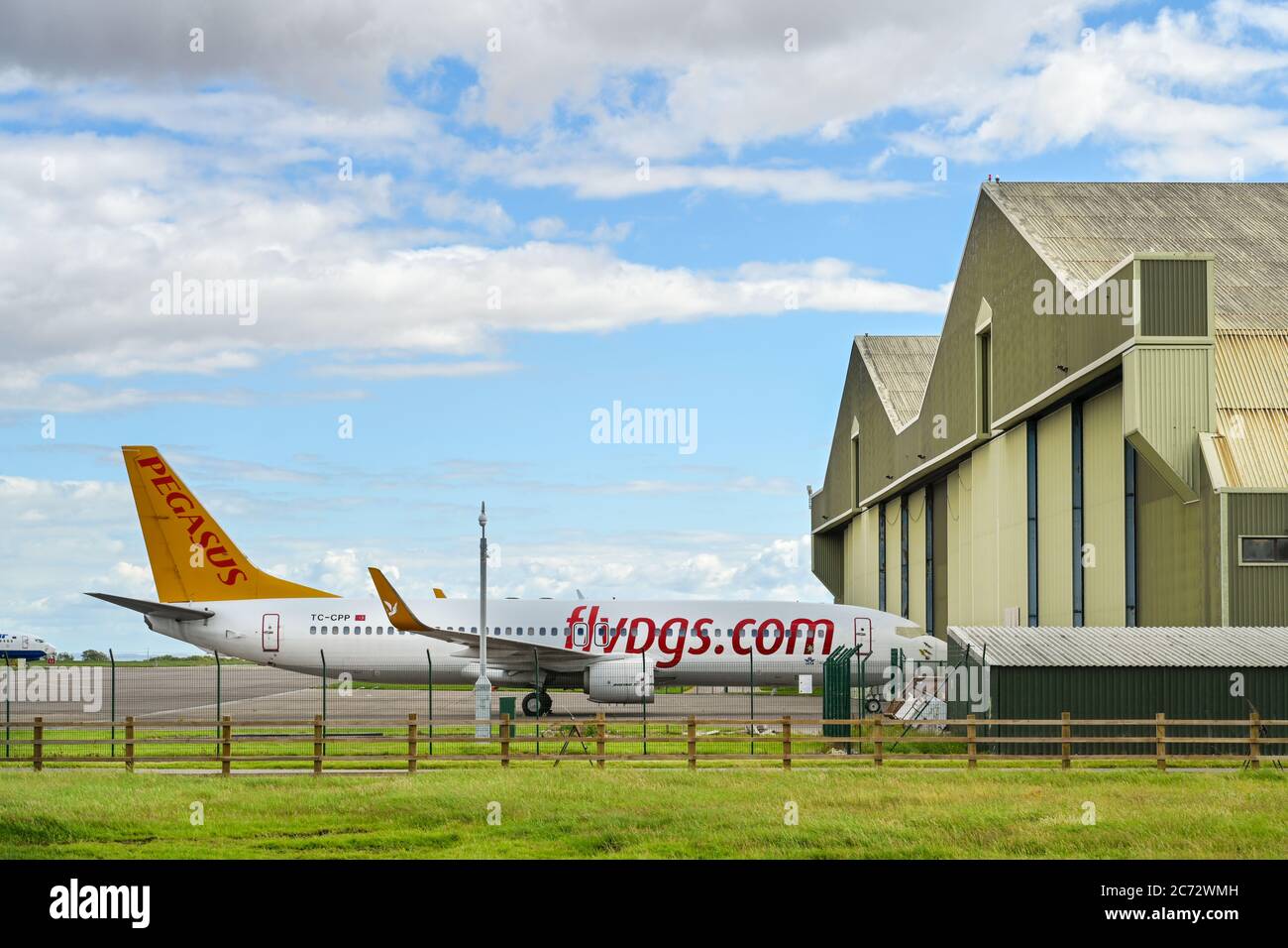 St Athan, Vale of Glamorgan, Wales - July 2020:  Boeing 737 of Turkish airline Pegasus outside the hangars of Cardiff Aviation Stock Photo
