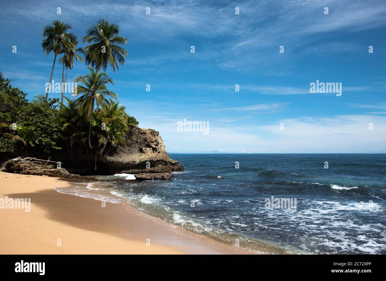 Wild caribbean beach, raw jungle Rainforest beach, Manzanillo Puerto Viejo Costa Rica, Central Latin America blue sky sea water ocean, miss may point Stock Photo